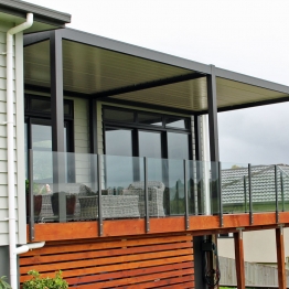 Large deck protected by a multibay stunning Bask louvre roof